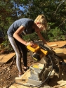 Young girl using a Miter Saw